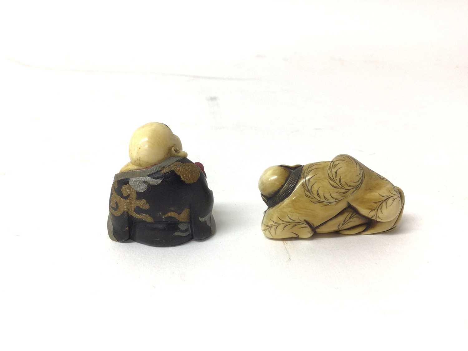 Two 19th century Japanese carved figures of Buddha, one a netsuke and shown reclining, the other pai - Image 2 of 3