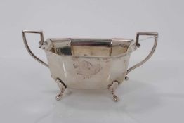 1930s silver sugar bowl of octagonal form with two angular handles raised on four pad feet, (Sheffie