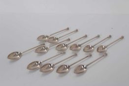 Set of twelve George V silver seal top tea spoons, each bowl engraved with a letter C, (Sheffield 19