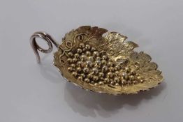 George III silver gilt leaf and grape embossed caddy spoon with loop handle, Birmingham 1808, maker