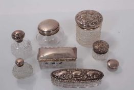 Group of seven Victorian and later silver topped cut glass vanity jars together with a cut glass sce