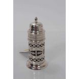 Edwardian silver sugar caster of lighthouse form, with pierced decoration and blue glass liner, (Bir