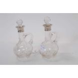 Pair George V silver mounted cut glass bottles, (London 1929), maker Henry Hobson & Sons, each 17cm