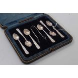 Set of six George V silver coffee spoons together with matching sugar tongs, (Sheffield 1912), maker