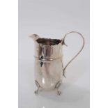 George V silver milk, raised on four claw and ball feet, (Birmingham 1910), maker J Sherwood & Sons,