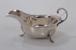 George V silver sauce boat of helmet form, (Sheffield 1932), 4oz, 14.5cm in length.