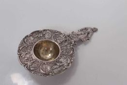 Early 20th century Dutch silver tea strainer with figural decoration, stamped 830 and with import ma