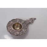 Early 20th century Dutch silver tea strainer with figural decoration, stamped 830 and with import ma