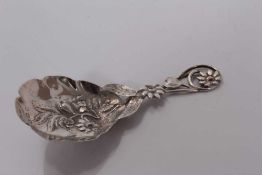 Victorian silver caddy spoon with embossed floral bowl and pierced floral handle, Birmingham 1866, H