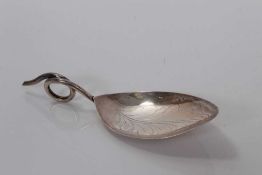 George III silver leaf-shaped bowl caddy spoon with bright cut decoration and loop handle, possibly