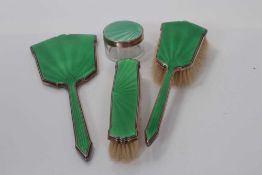 George V silver hand mirror with green guilloche enamel decoration, together with two matching brush