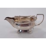 George III silver milk jug, raised on four ball feet, (London 1810), makers mark rubbed, 18.5cm in o