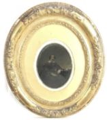 Pair of Edwardian embossed brass photograph frames containing period photographic portraits, 31cm x