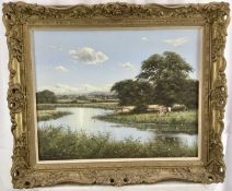 David Morgan (Born 1947) - oil on canvas in gilt frame - Cows grazing in meadow by river