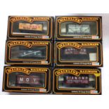 Mainline OO gauge rolling stock including Hopper, Coke and 7 Plank wagons, all boxed (25)