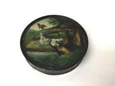Regency circular papier-mâché erotic table snuff box of circular form with painted dog chasing a duc