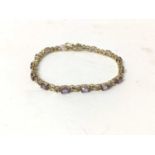 Amethyst and diamond bracelet with oval mixed cut amethysts and single cut diamonds in 9ct gold sett