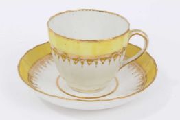 A Derby faceted tea cup and saucer, with yellow ad gilt borders, circa 1790