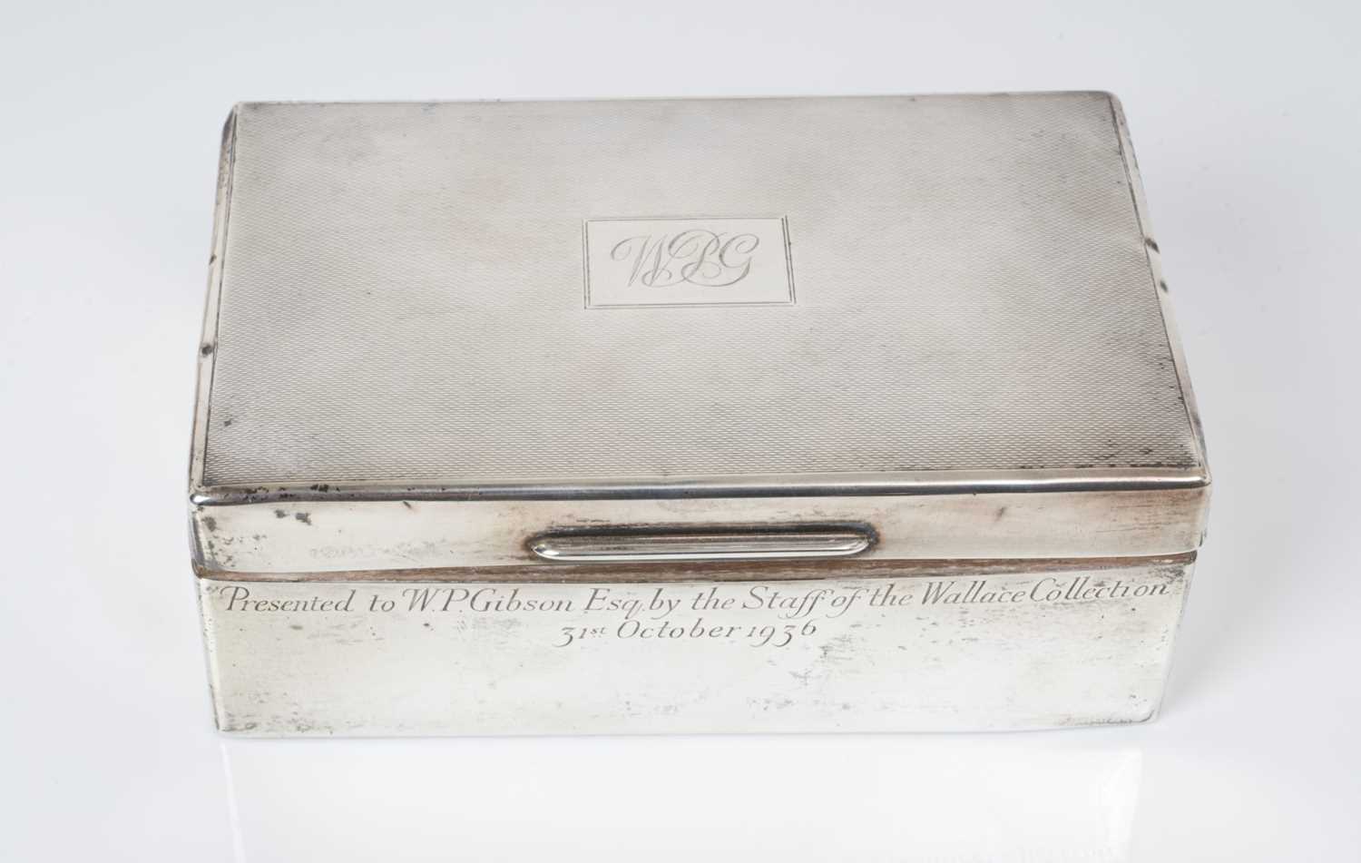 George V silver cigarette box of rectangular form with engine turned decoration and engraved present