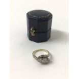 Diamond three stone ring with theee brilliant cut diamonds in platinum cross-over setting on 18ct ye