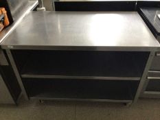 A freestanding stainless steel preparation bench, with two shelves under, on castors, 1200 mm