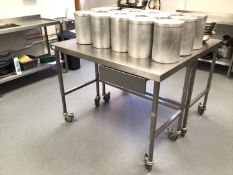 A stainless steel freestanding preparation bench, with drawer, on castors, 1200 mm