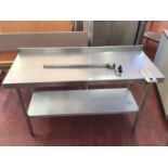 A wall mounted stainless steel preparation bench, with shelf under and fitted can opener, 1500 mm