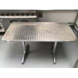 A brushed stainless steel rectangular top table, with plated column pedestals, 1200 mm x 600 mm