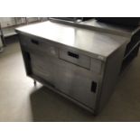 A wall standing stainless steel preparation bench, with two drawers, and double sliding doors, 1200