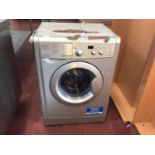 An Indesit WDD71535 washing machine, together with a Zanussi ZDC 46130W dryer, cables and plugs