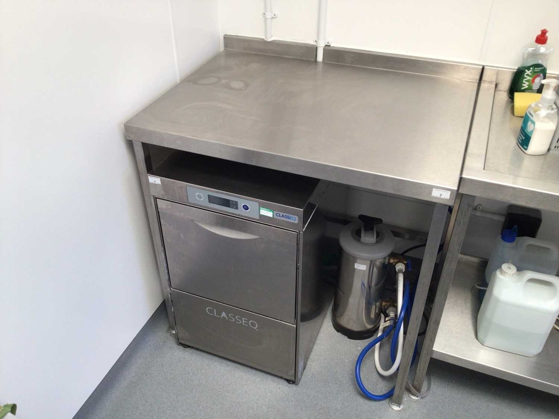 A wall standing stainless steel preparation bench, 900 mm