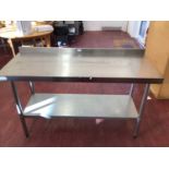 A wall standing stainless steel preparation bench, with shelf under, 1500 mm