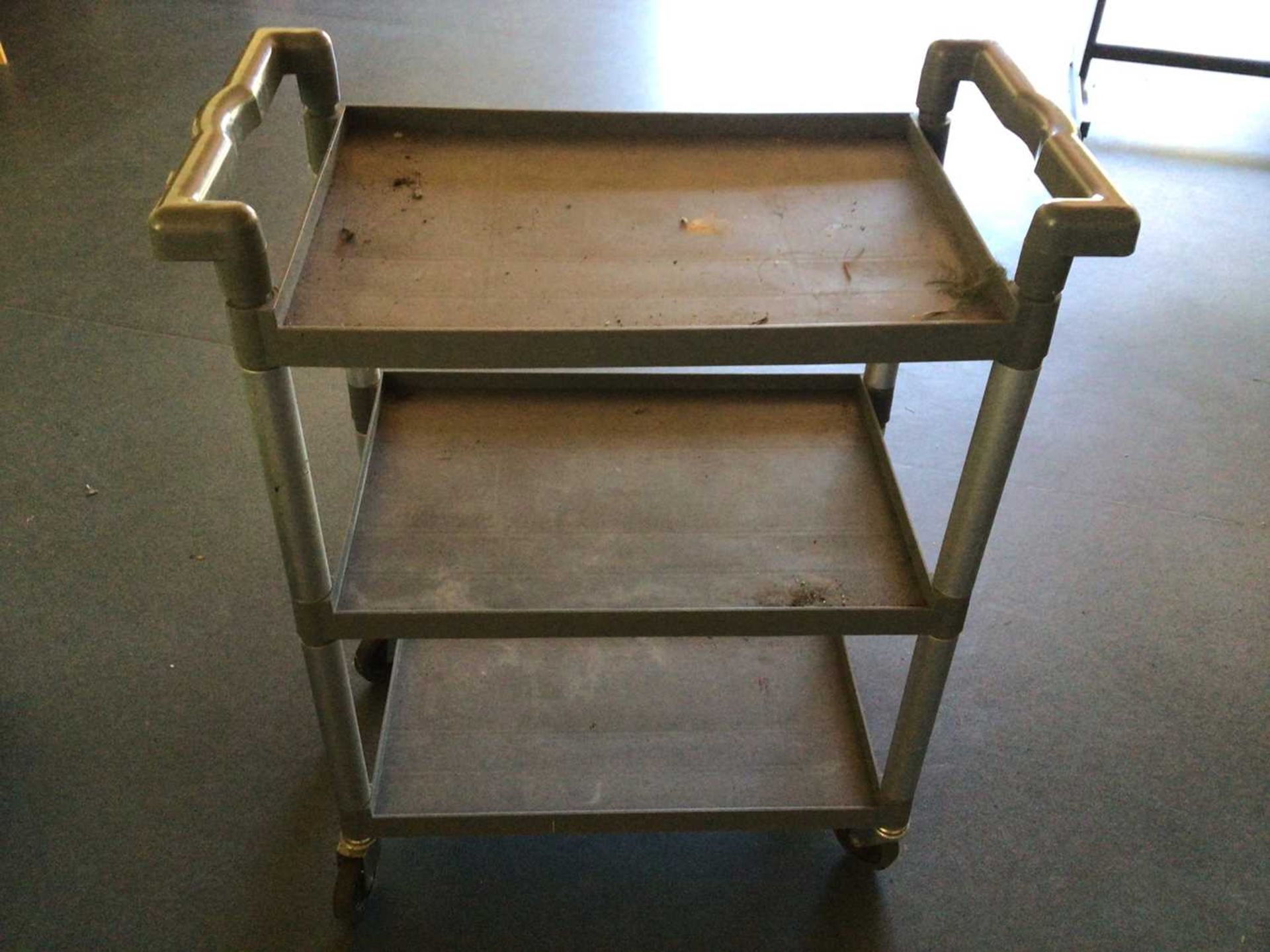 A black plastic two tier tea trolley, on castors, 610 mm x 460 mm - Bild 2 aus 2