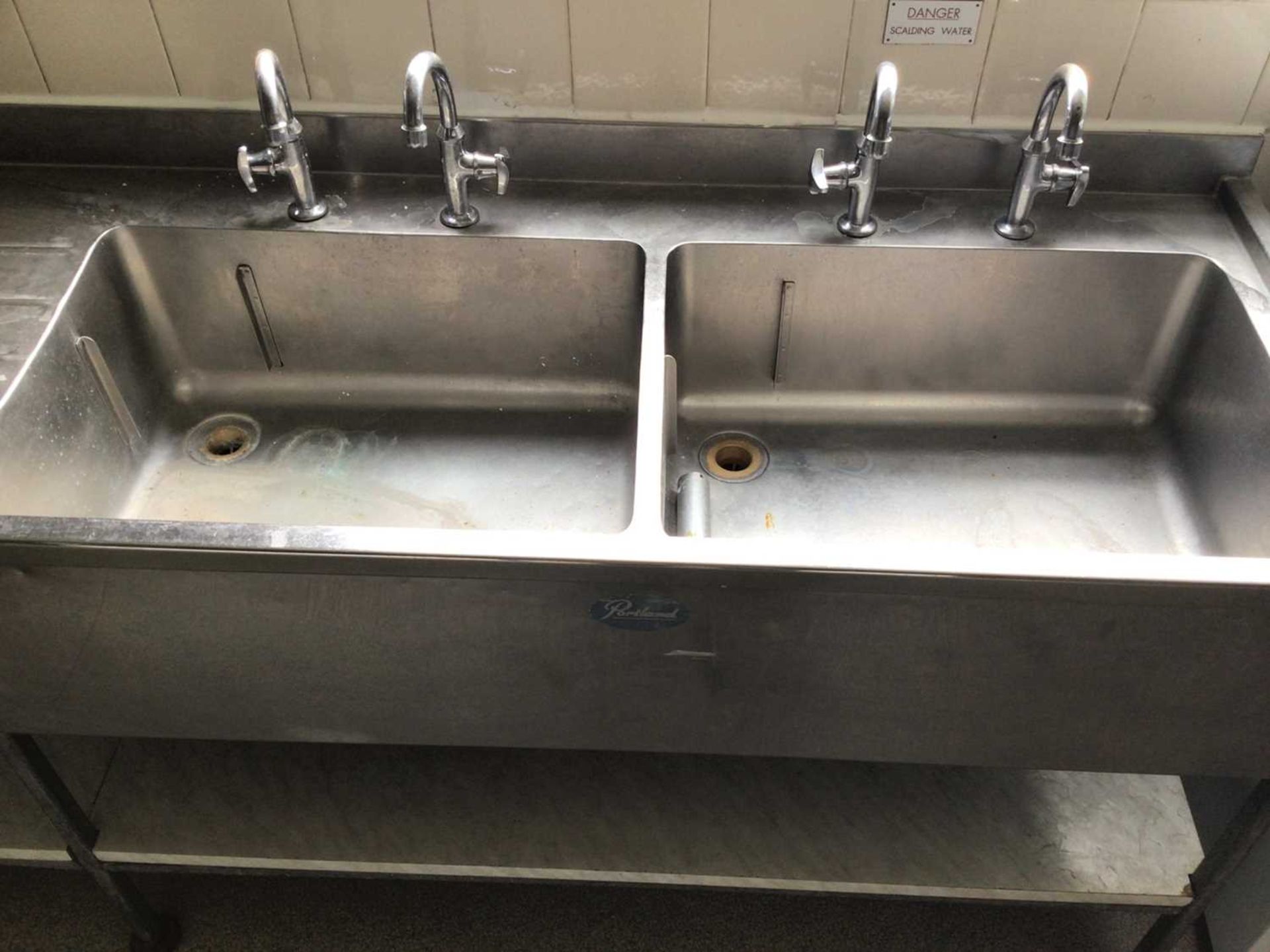 A Portland stainless steel double bowl sink unit, with two pairs of taps and draining board, laminat - Bild 2 aus 2