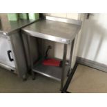 A wall standing stainless steel preparation bench, with undershelf, 600 mm