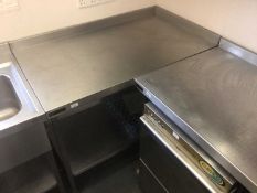 A stainless steel corner wall mounted preparation bench, with undershelf, 1210 mm