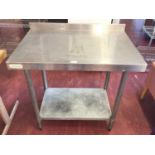 A wall standing stainless steel preparation bench with shelf under, 900 mm