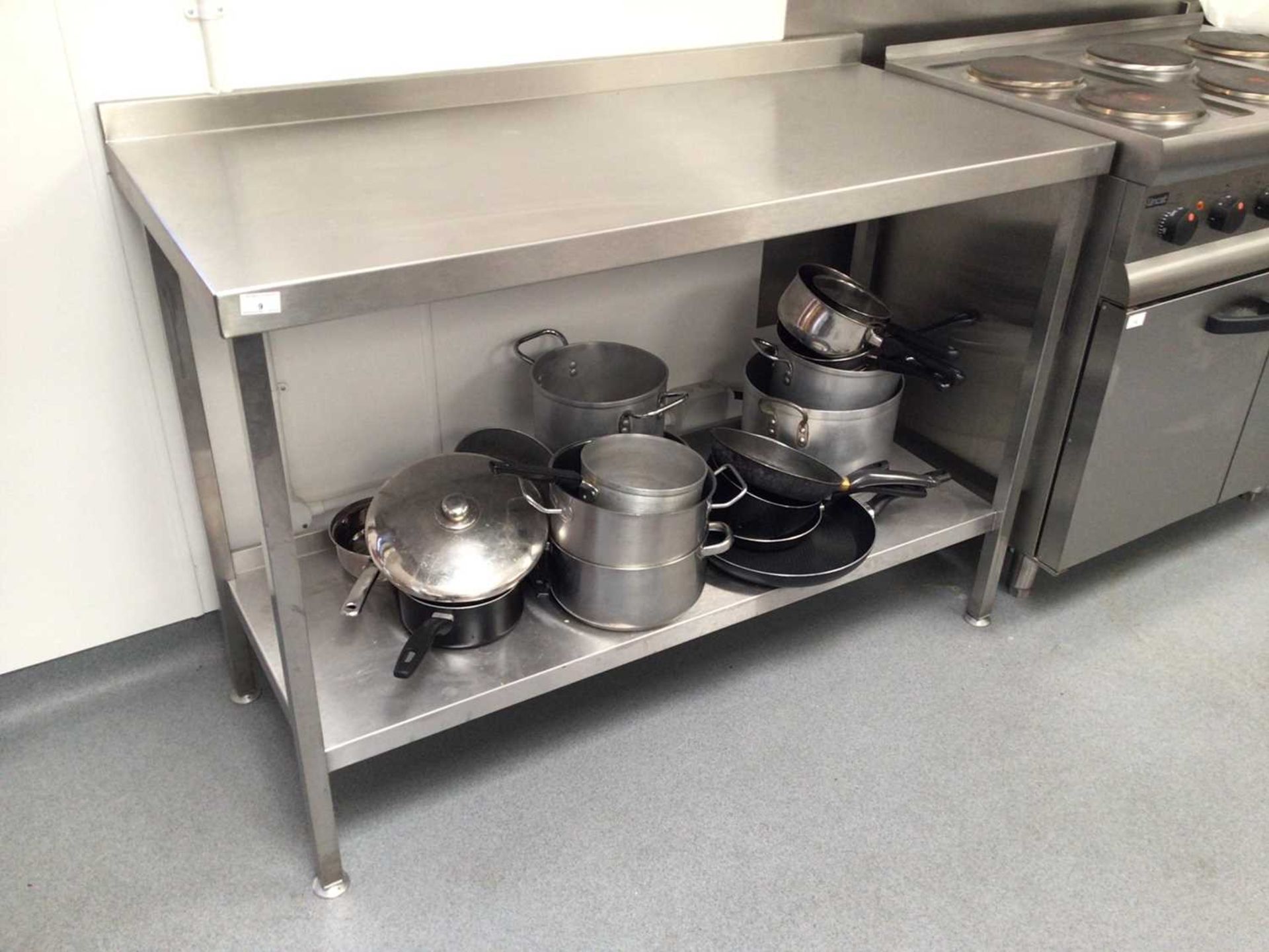 A wall standing stainless steel preparation bench, with undershelf, 1300 mm