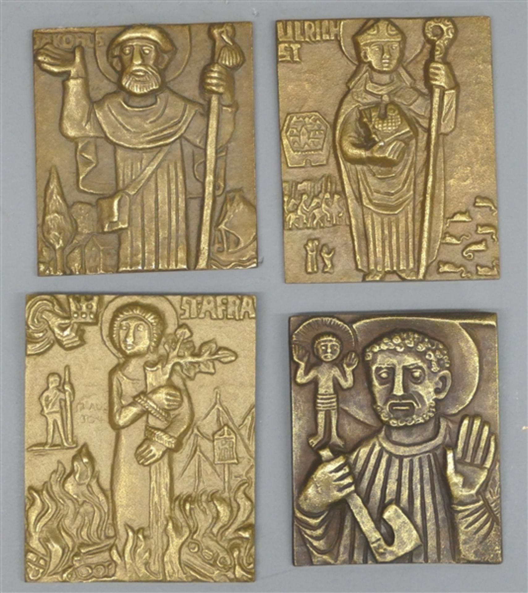 4 Bronzereliefs