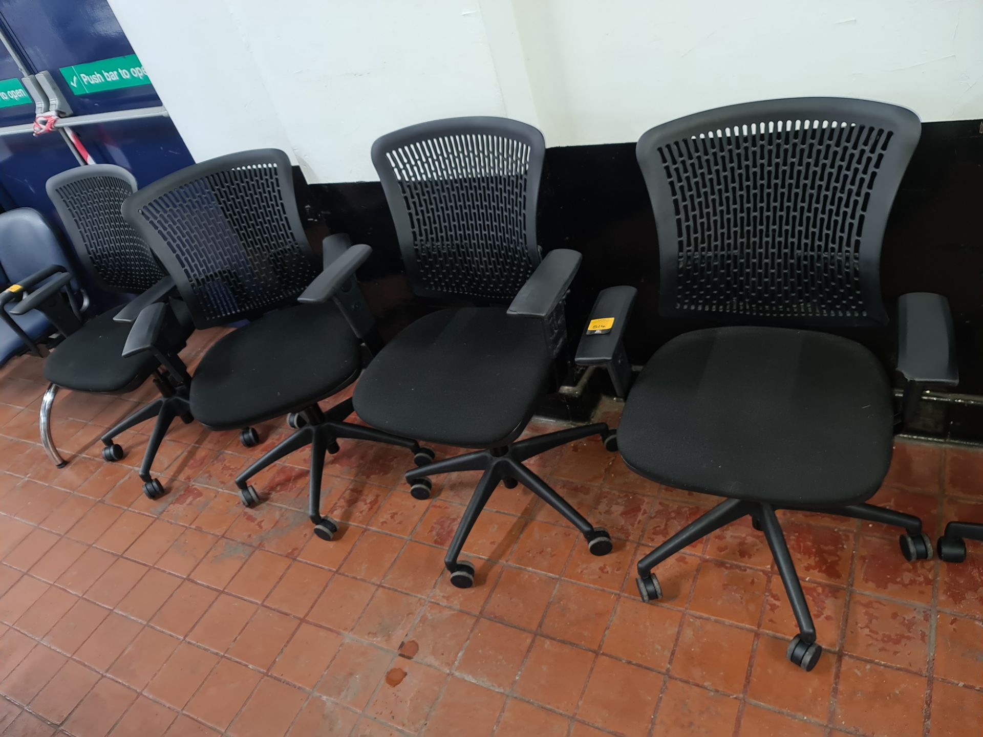 4 off matching black operator's chairs with black upholstered bases & black mesh style plastic backs