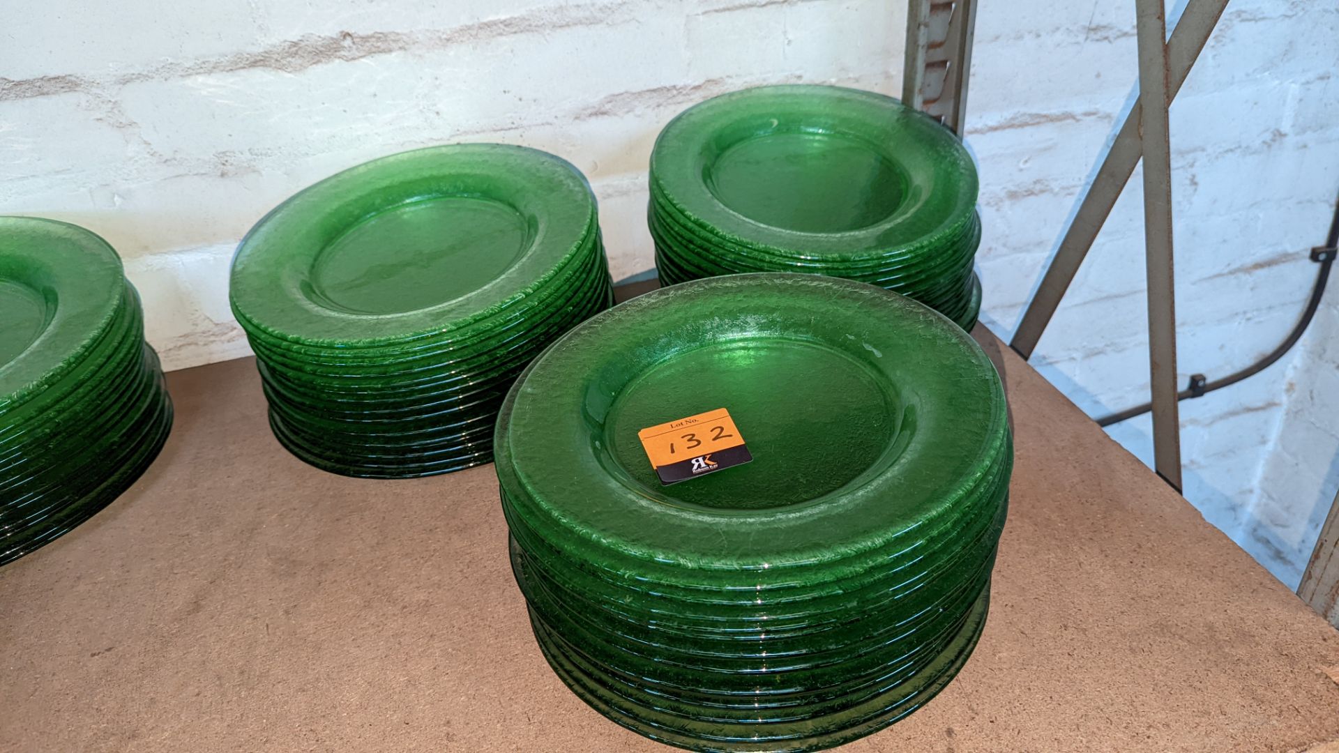 45 off green glass plates each approximately 275mm diameter (3 stacks)