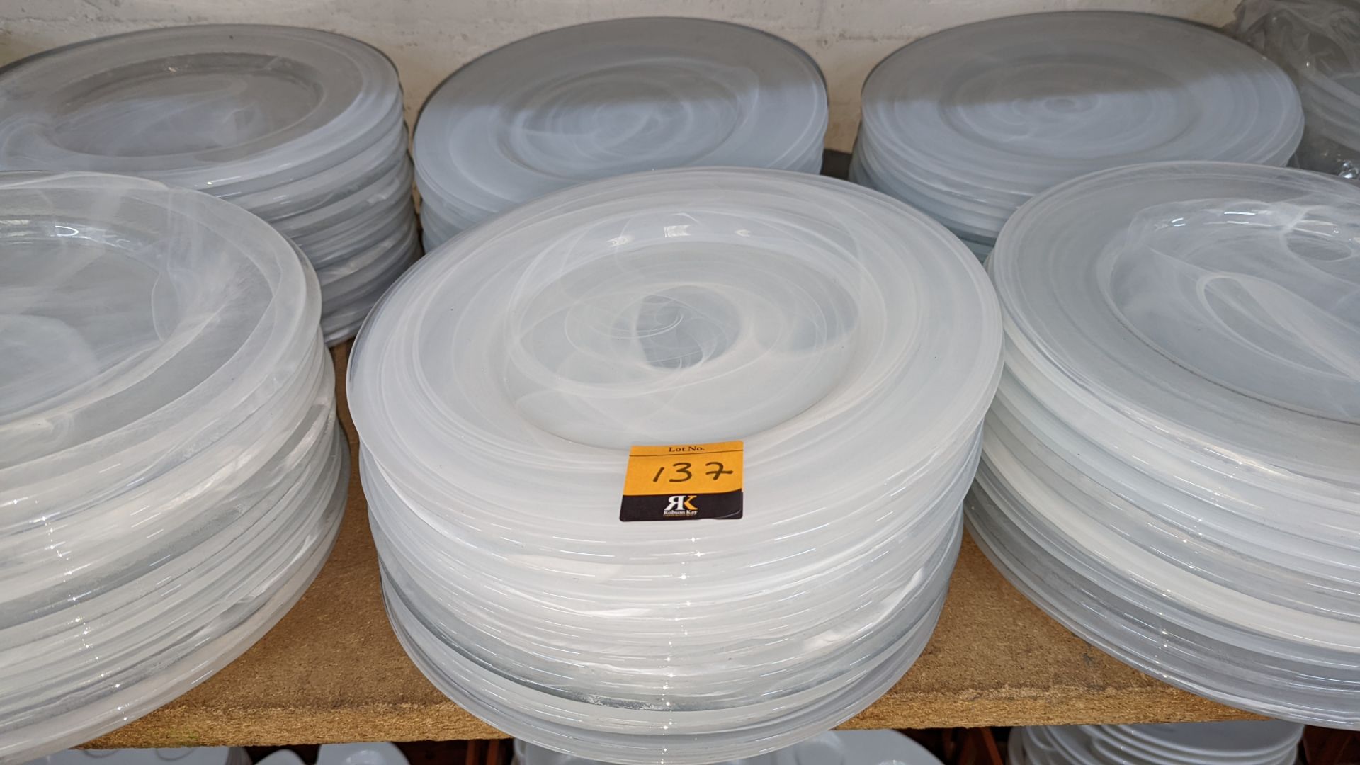 30 off large clear/white patterned glass plates, each measuring approximately 330mm diameter