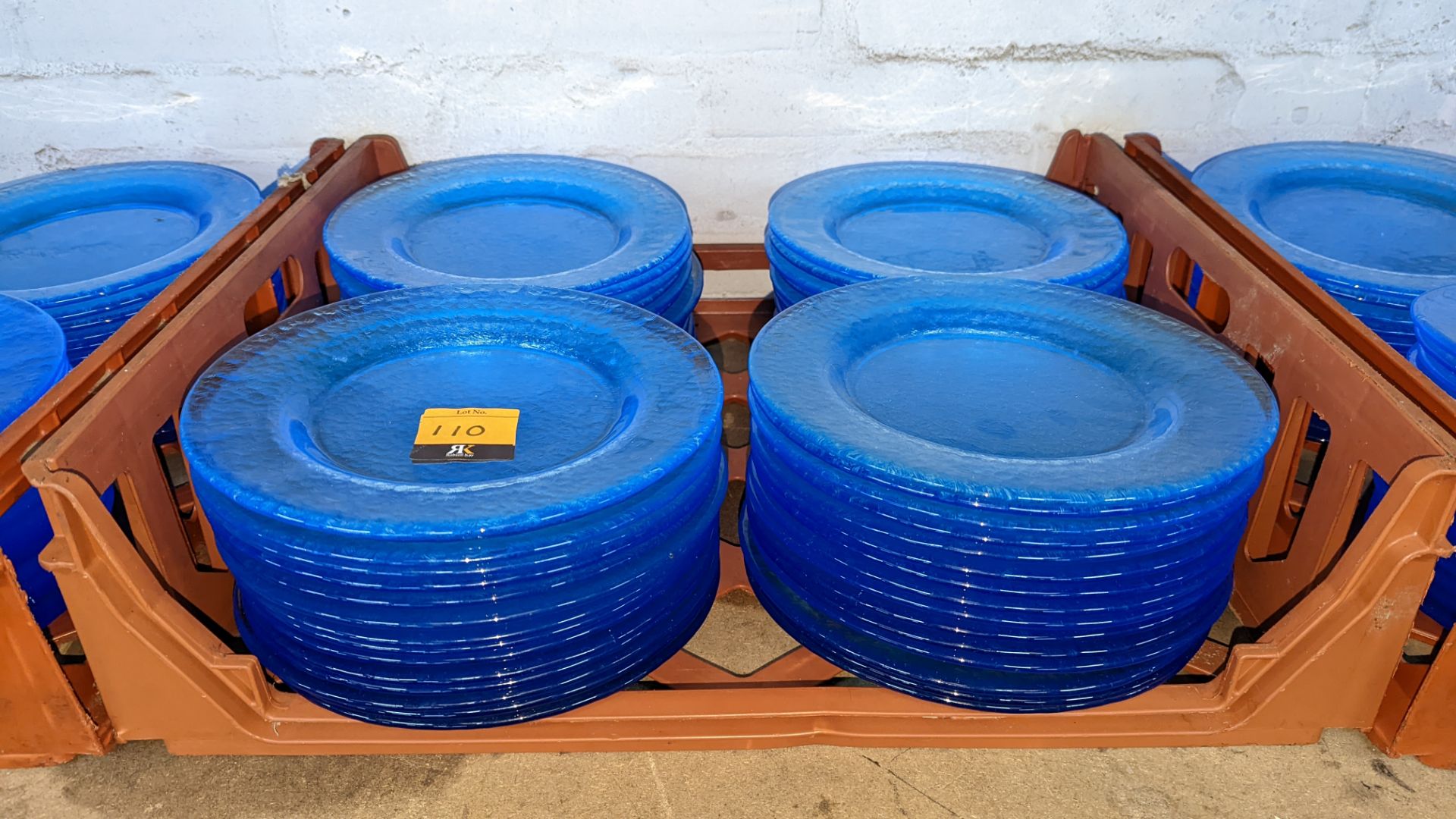 60 off blue glass plates each measuring approximately 26cm diameter