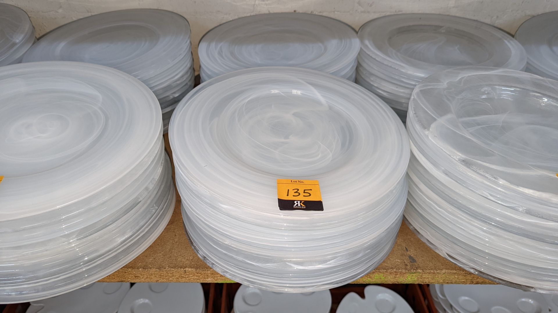 30 off large clear/white patterned glass plates, each measuring approximately 330mm diameter