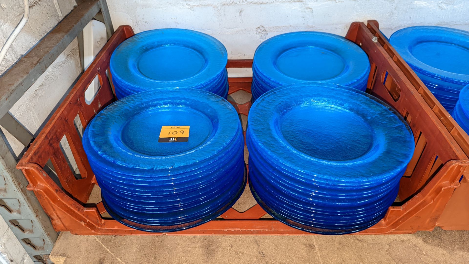 60 off blue glass plates each measuring approximately 26cm diameter