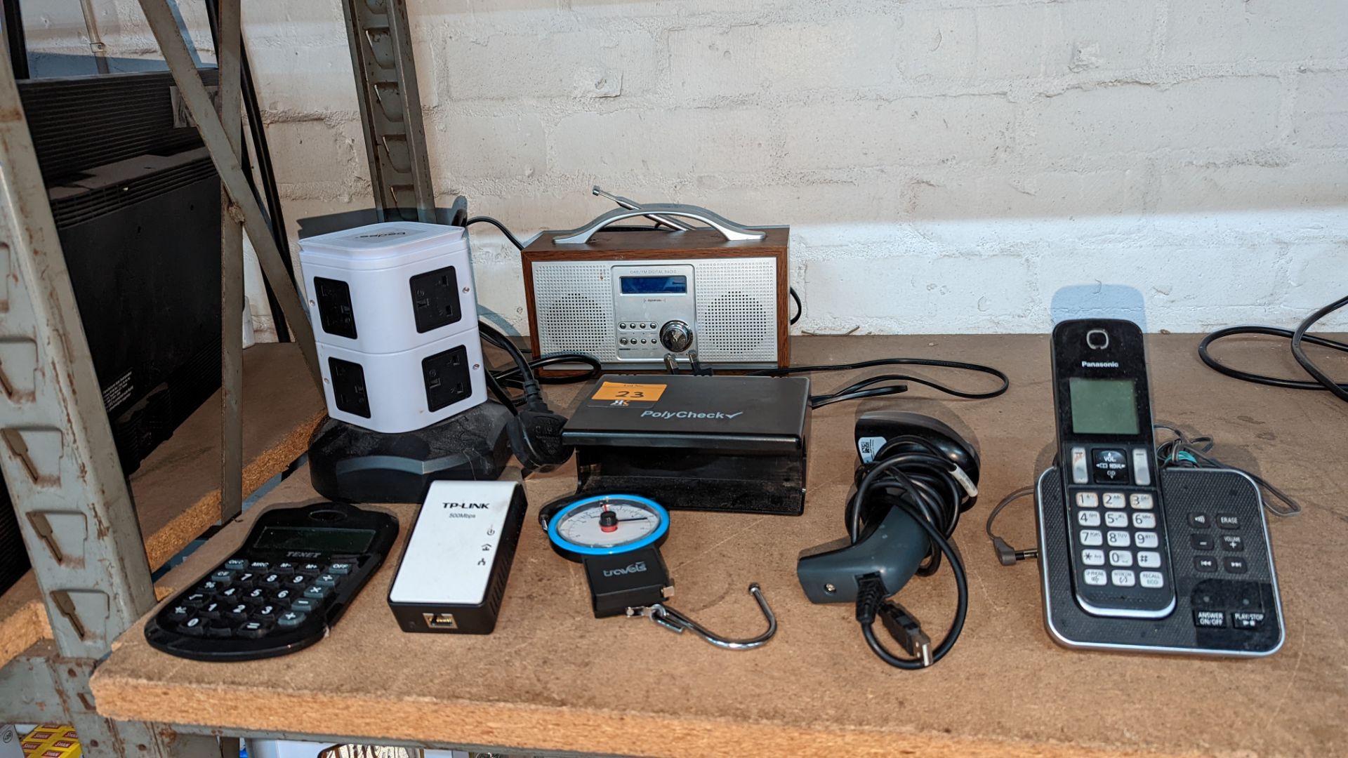Mixed lot including hand-held barcode reader, Travels scales, Powerline adaptor, DAB radio, note det