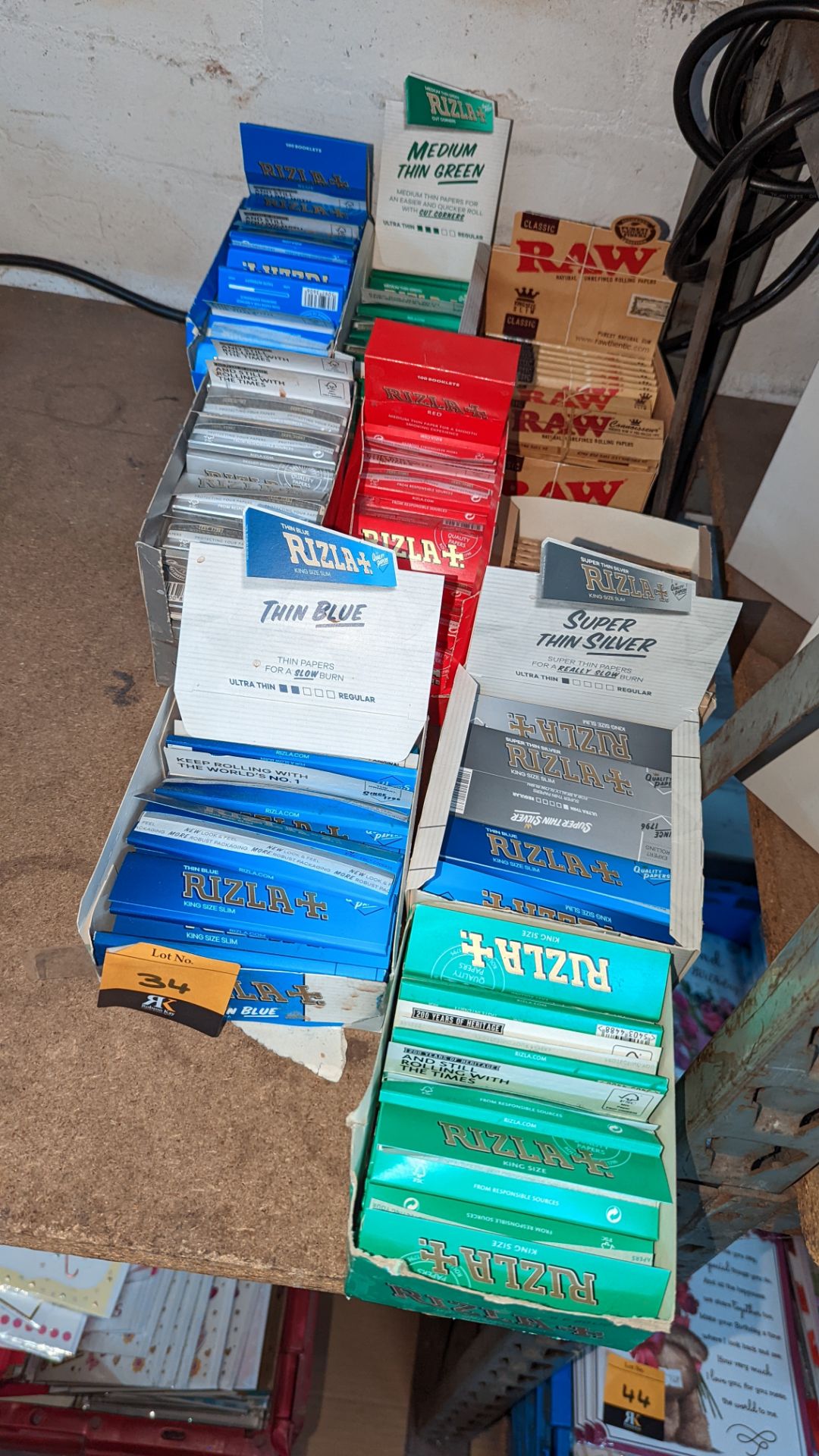 9 boxes of Rizla & other cigarette papers NB. Most of the boxes are only part full