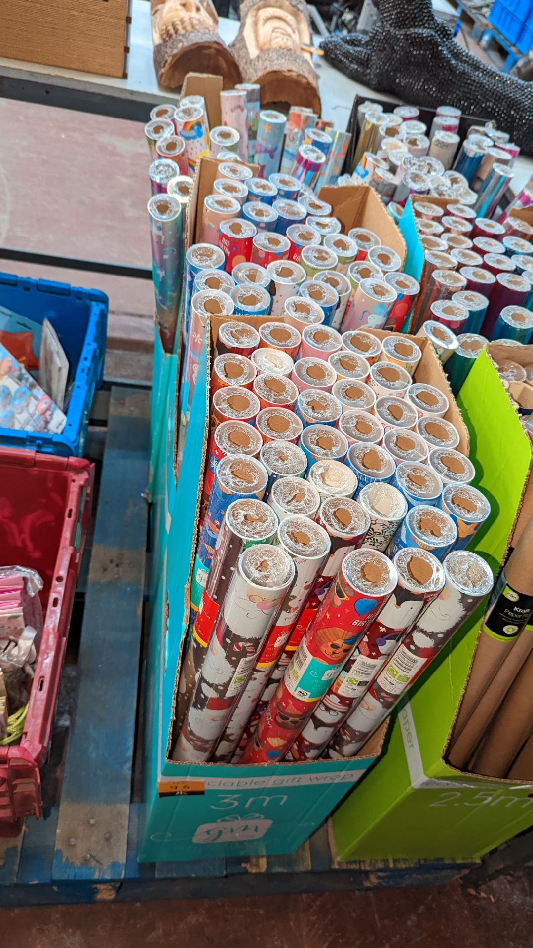 3 dispensers & their contents of gift wraps - approx. 95 rolls of gift wrap in total