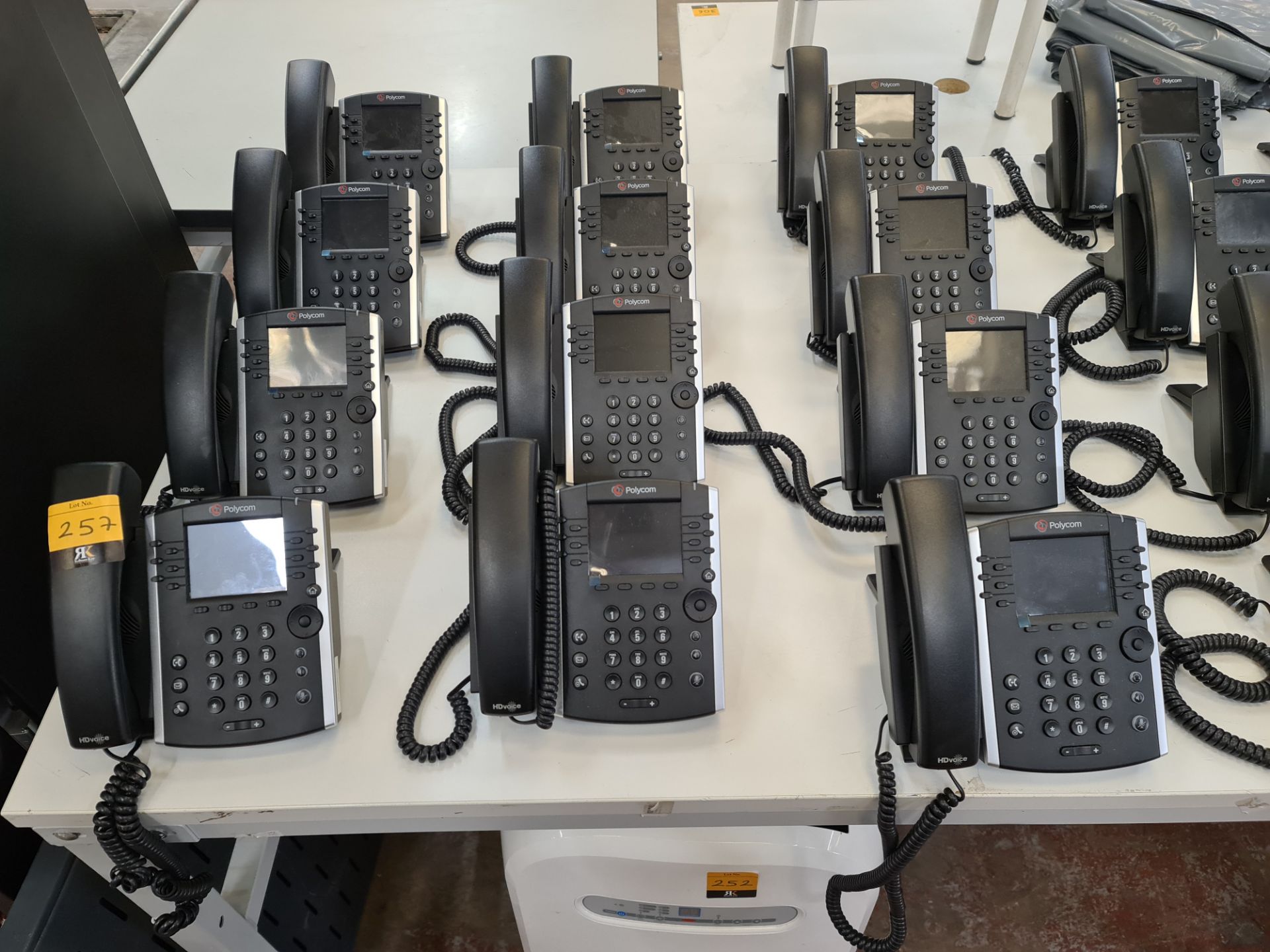 12 off Polycom model VVX411 telephone handsets