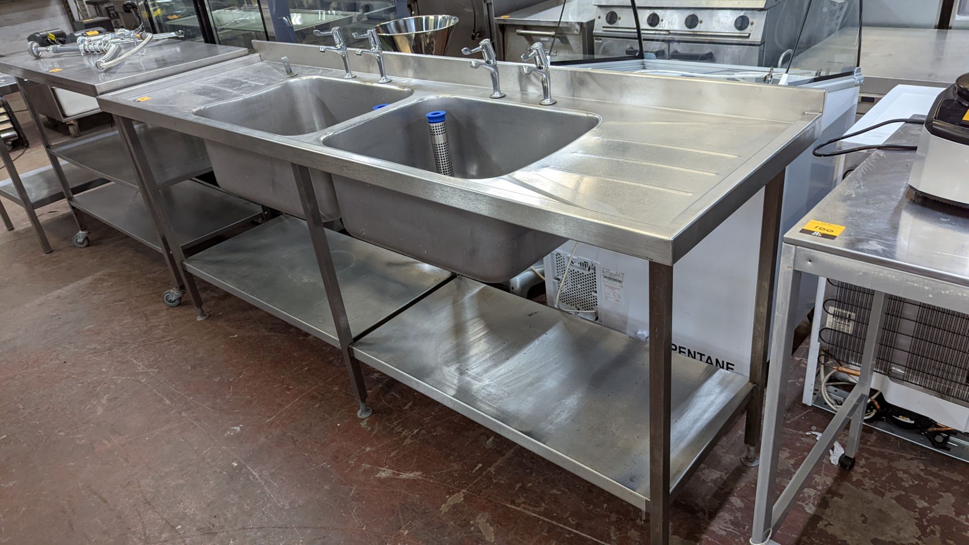 Large stainless steel twin bowl sink arrangement incorporating taps, drainers & shelves below, max e - Image 6 of 6